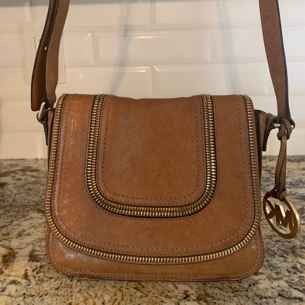 Michael Kors brown leather zipper crossbody purse.